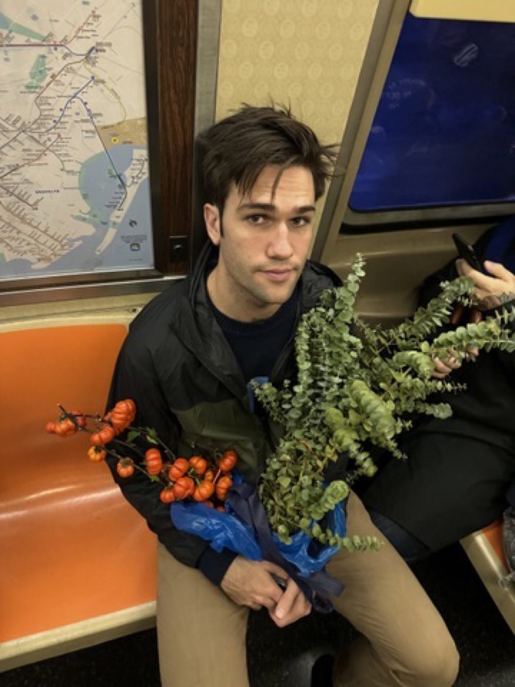 Riding the subway home cradling armfuls of autumn flowers