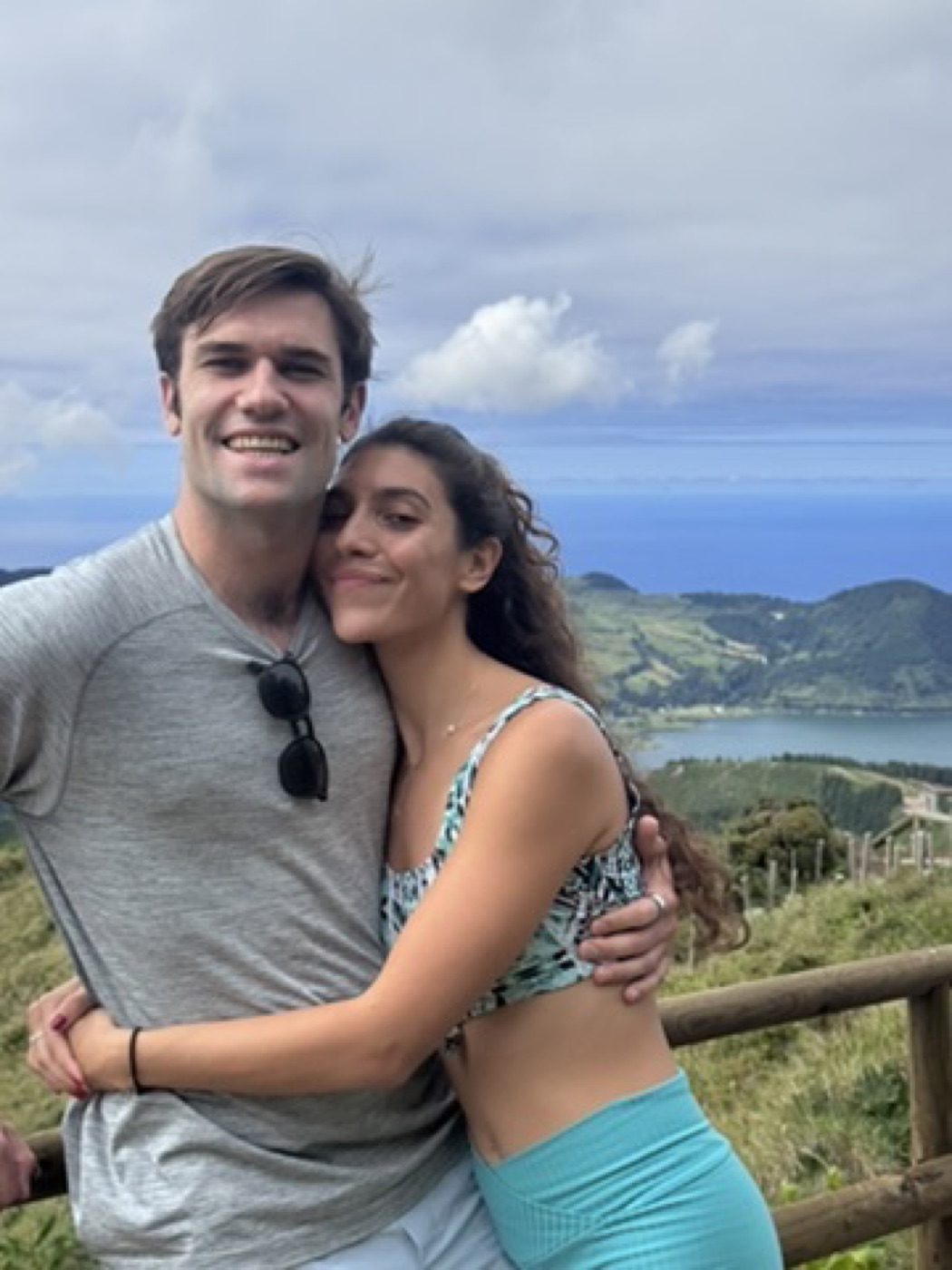 Warm full-body hug with his partner at the crater ridge