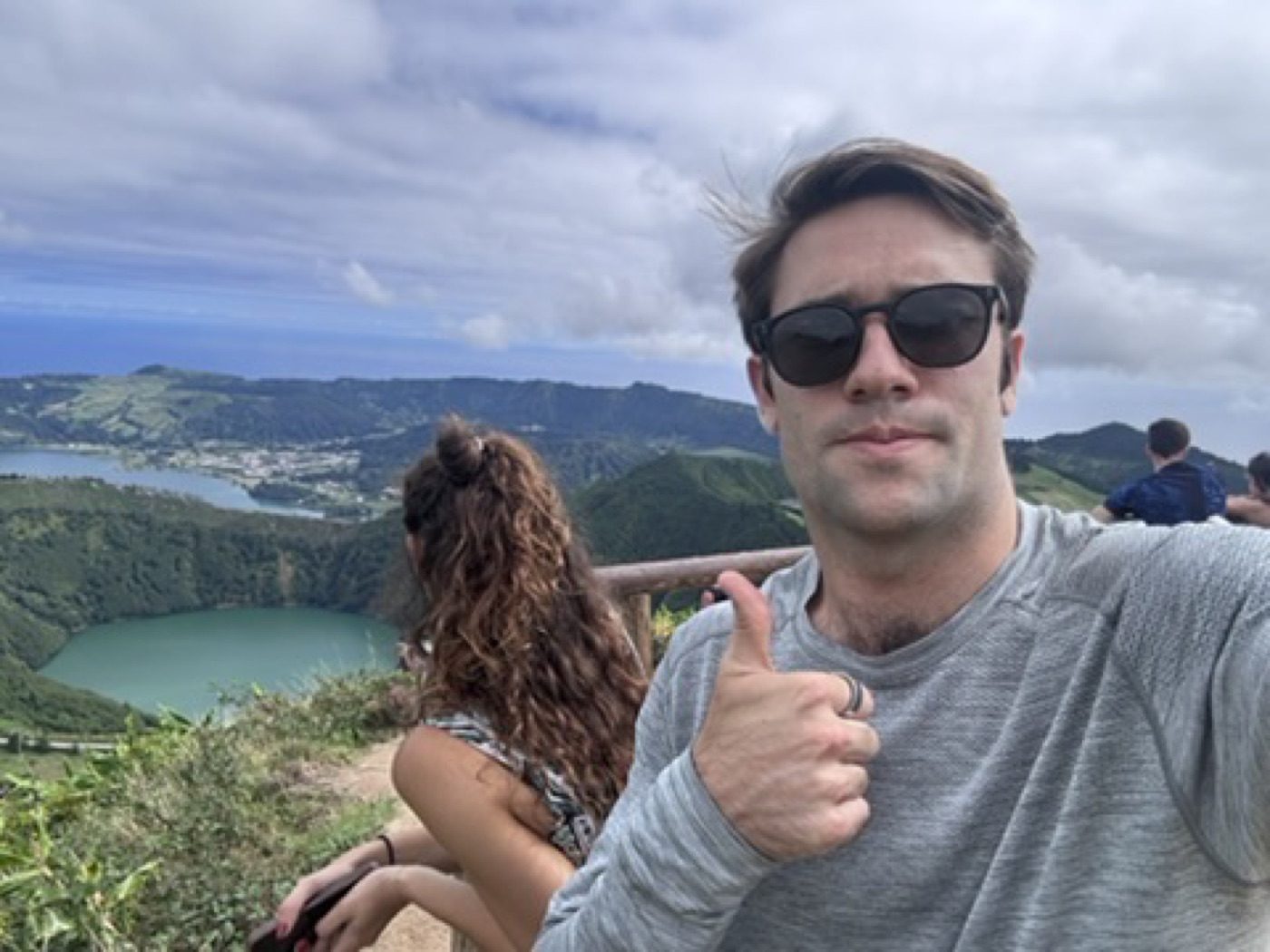 Playful sunglasses thumbs-up selfie at the overlook
