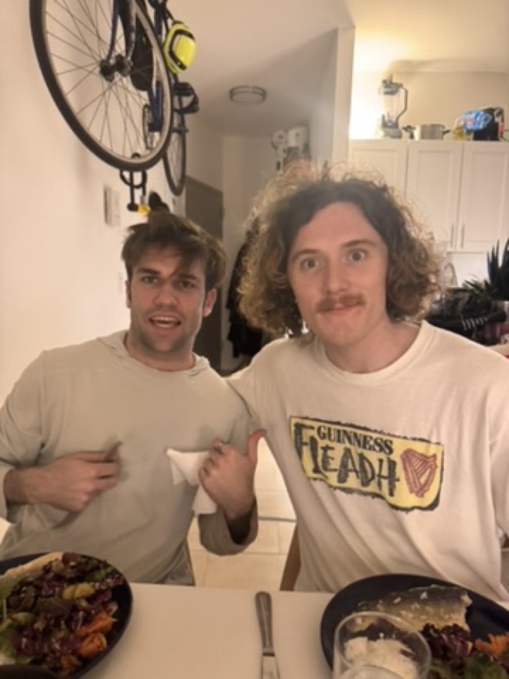 Goofy grins over homemade salads with a good buddy