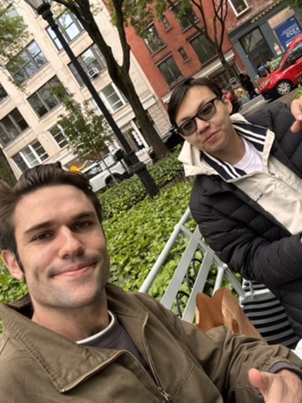 Sunny sidewalk selfie with a friend grabbing lunch
