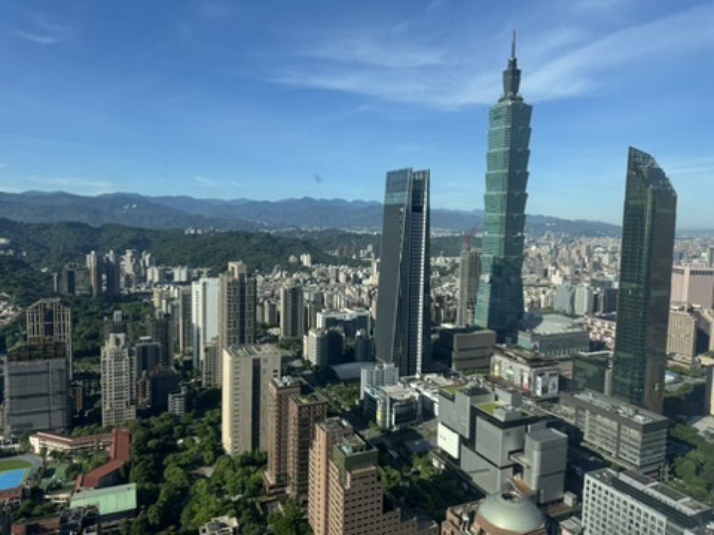Taipei 101 commanding a clear-sky skyline