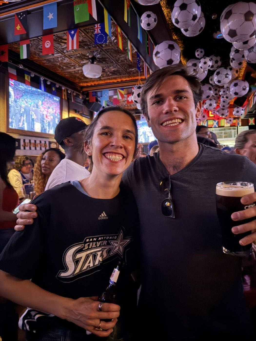 Couple at a soccer bar, lively World Cup atmosphere