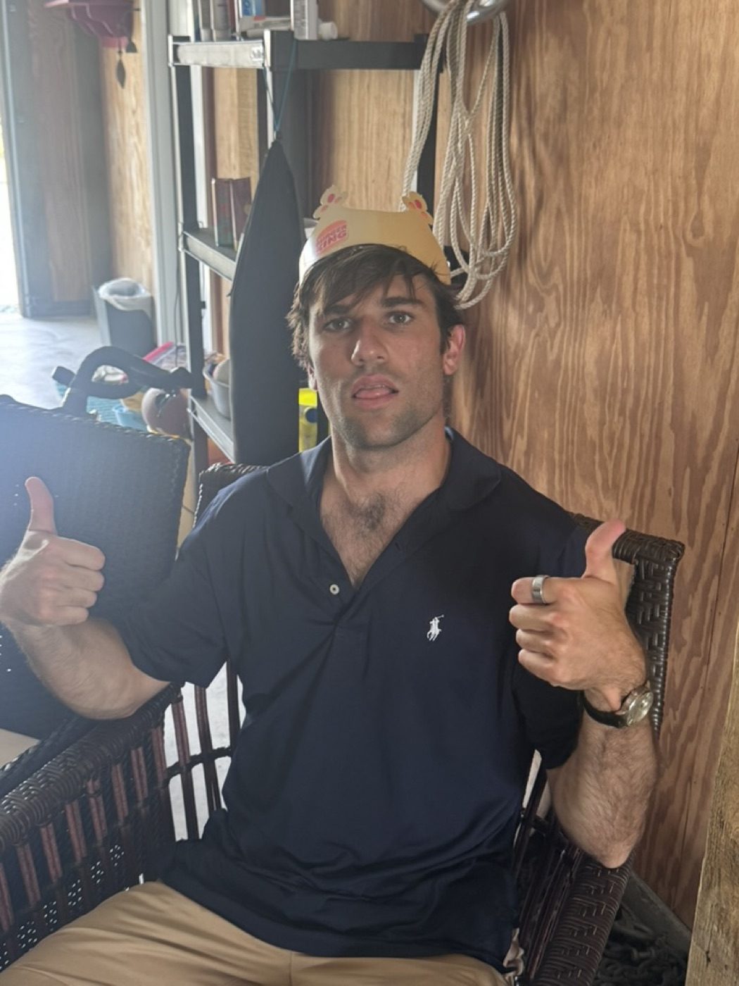 Goofing off in a Burger King crown, double thumbs-up