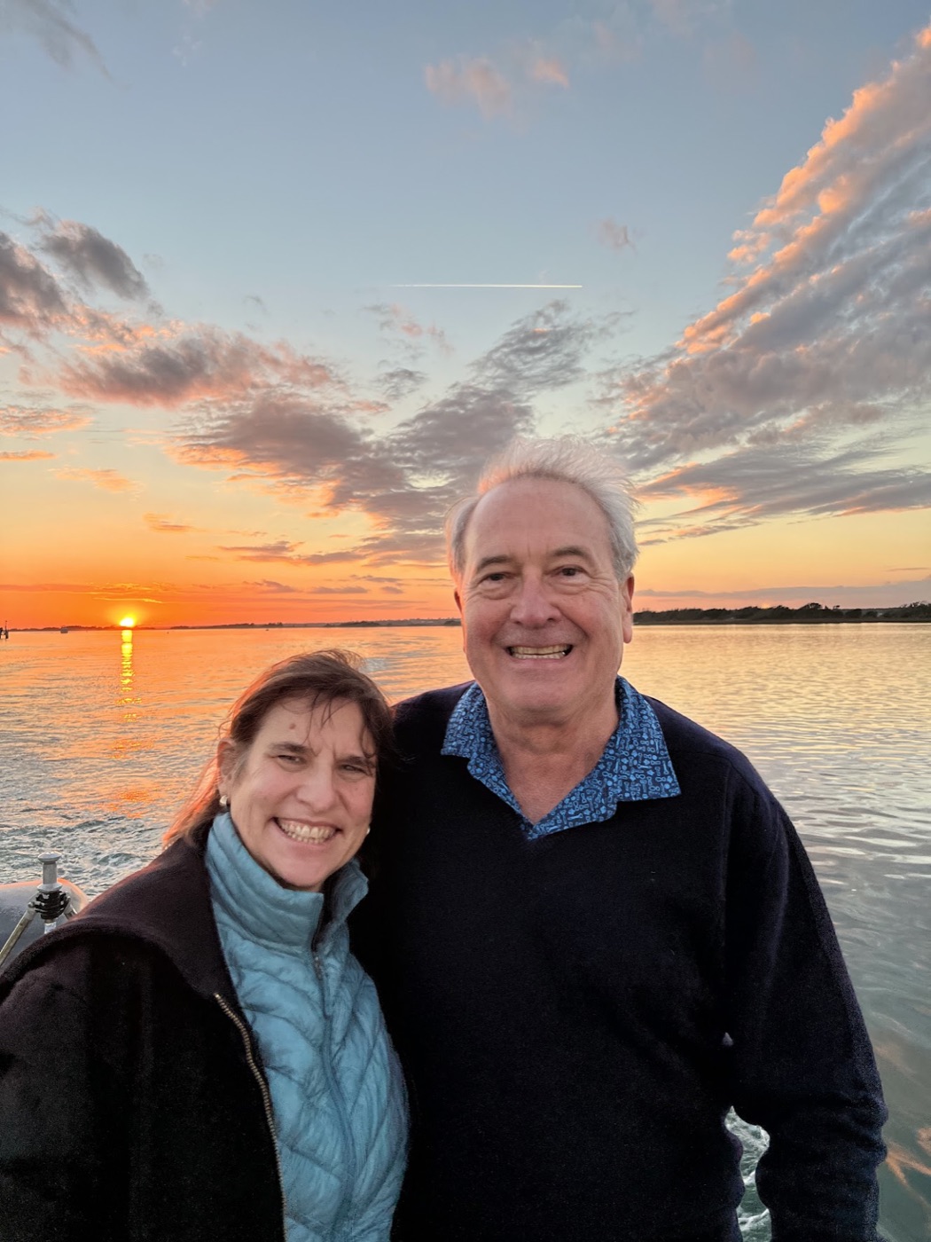 Sunset from the boat, two very happy passengers