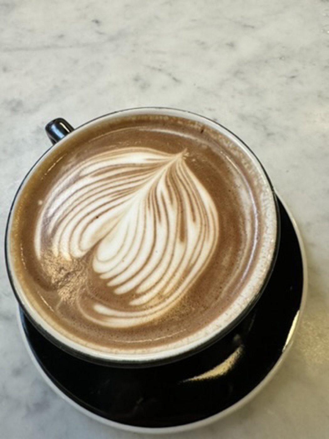 Latte art close-up on marble